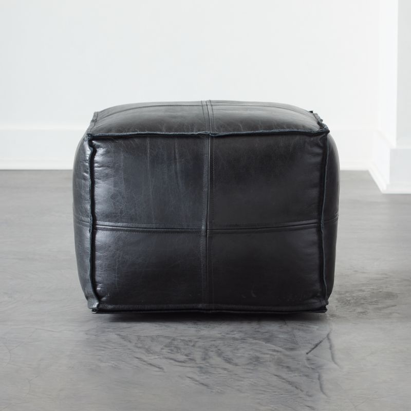 Black leather pouf
